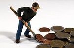 Debtors consistently make payments to cut down on debt each month. Man shoveling change to get rid of debt