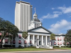 Florida's Historic Capitol in front of the Florida State Capitol tower in Tallahassee